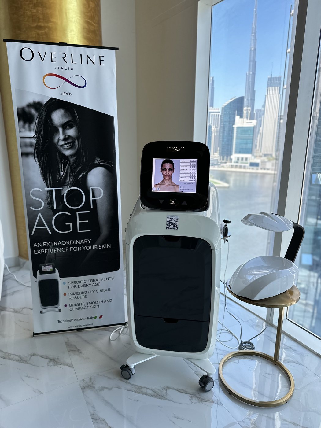 Overline aesthetic platform in a Dubai clinic with the city skyline behind it
