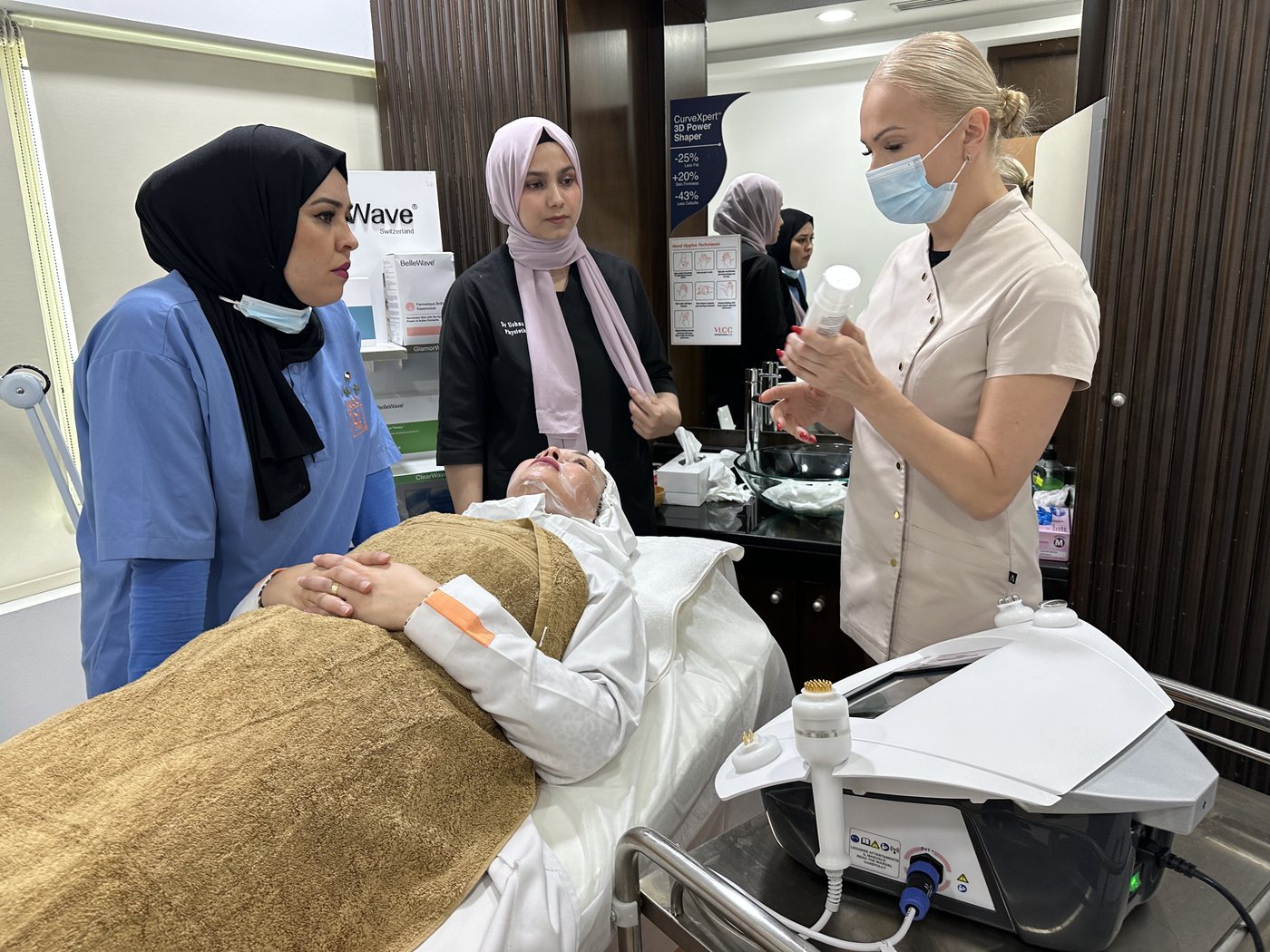 Trainer guiding a clinic team through a live treatment protocol